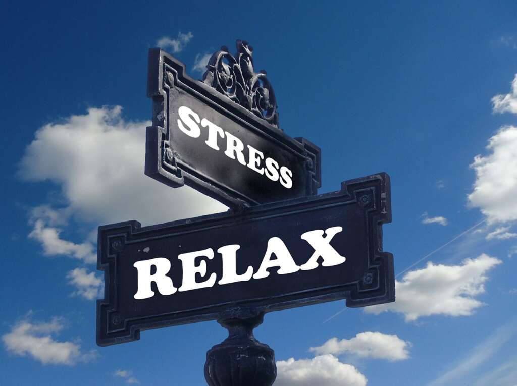street sign with relax on one and stress on the other