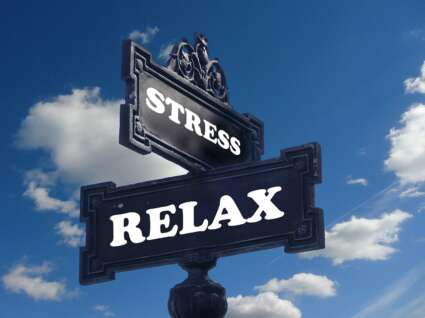 street sign with relax on one and stress on the other