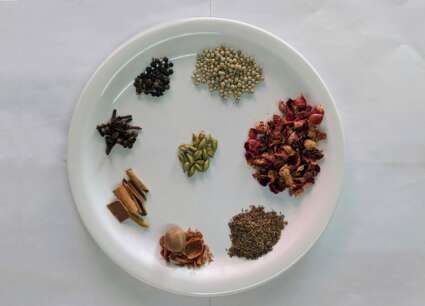 Herbs arranged in a circle on a plate
