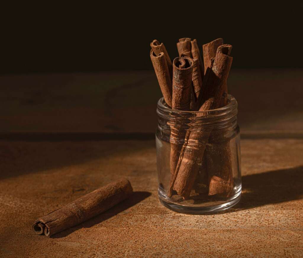 Cinnamon sticks in a jar on table